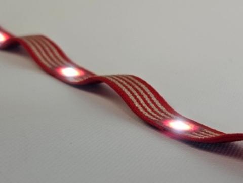Flexible conductive ribbon with integrated LEDs	